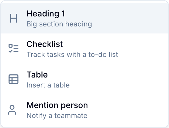 Slash command menu Slash command menu showing formatting, table, and mention options